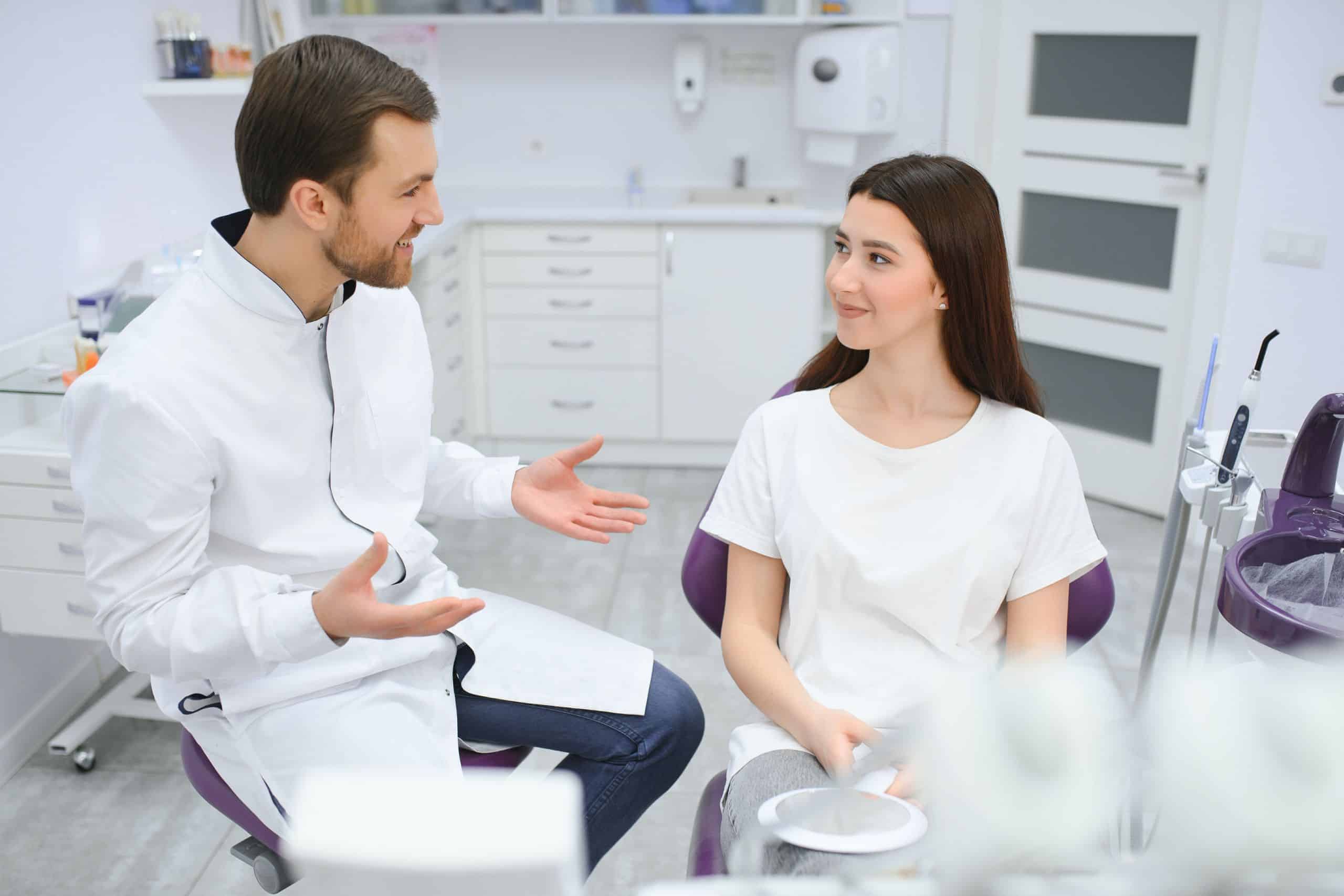 Dentist explaining benefits of choosing cosmetic dental procedure