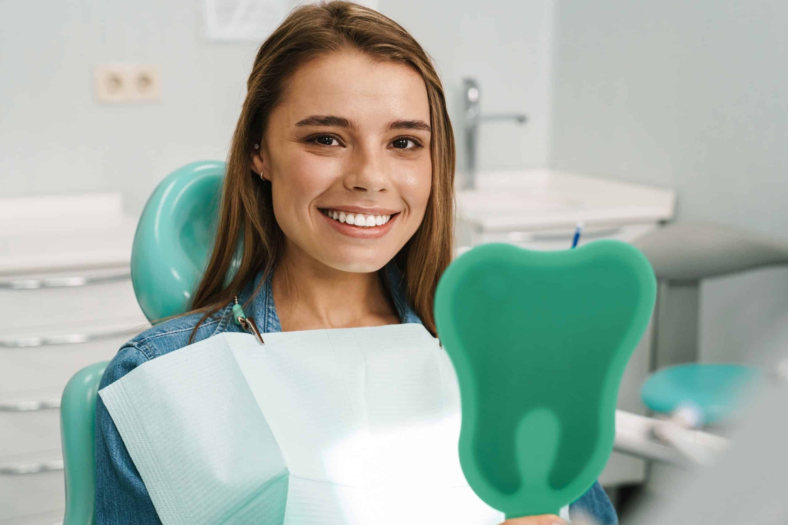 The woman is maintaining her Dental hygiene tips for valentines day that will keep her smile fresh.