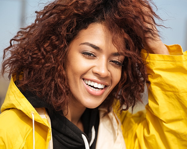 Girl confidently smiling after Cosmetic dentistry in Altamonte Springs