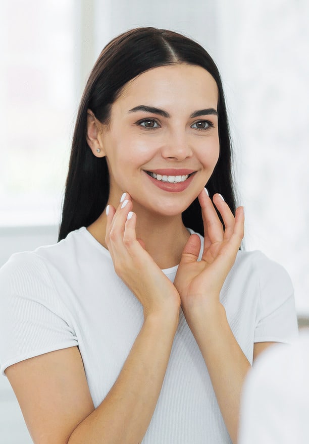 Happy woman admiring smile after Botox service at Altamonte Springs