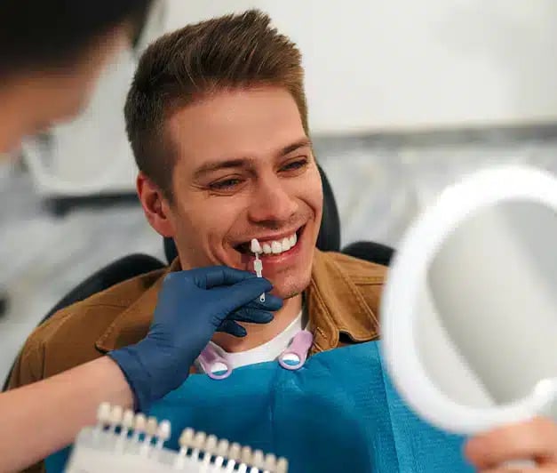 Man checking his shade for veneers at Altamonte Springs