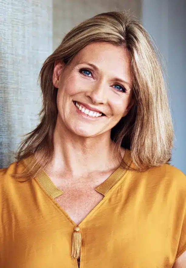 Smiling woman after dental implants at Darley Dental Care of Altamonte Springs