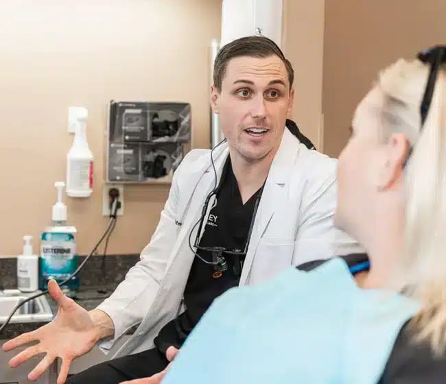 Dentist explaining the procedure to patient during emergency dentistry in Altamonte Springs