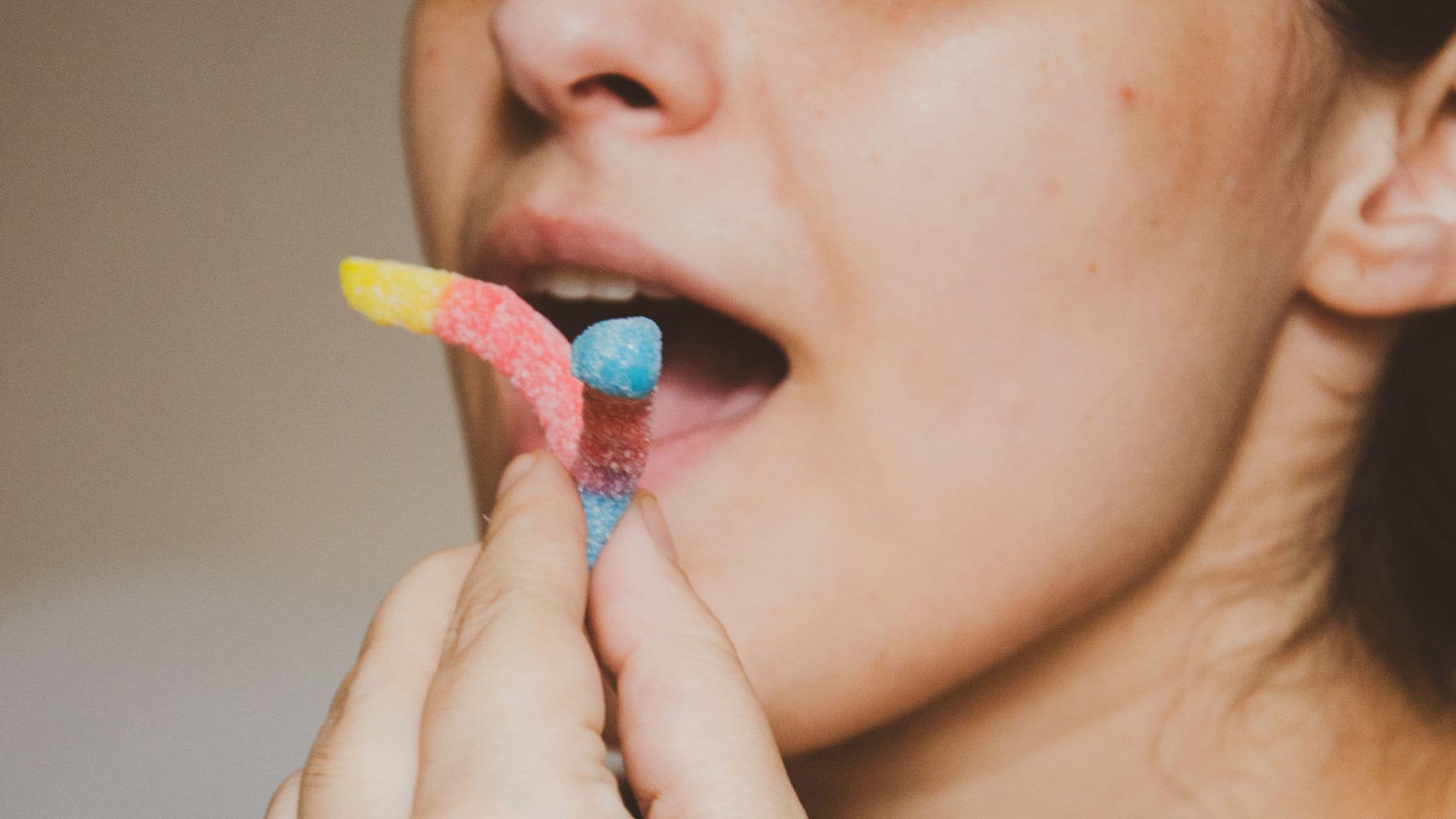 The women eating sticky candies which can cause a broken tooth